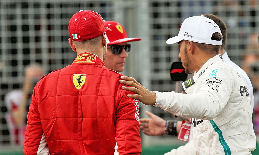 Pole sitter Lewis Hamilton (GBR) Mercedes AMG F1 with Sebastian Vettel (GER) Ferrari and Kimi Raikkonen (FIN) Ferrari in qualifying parc ferme.