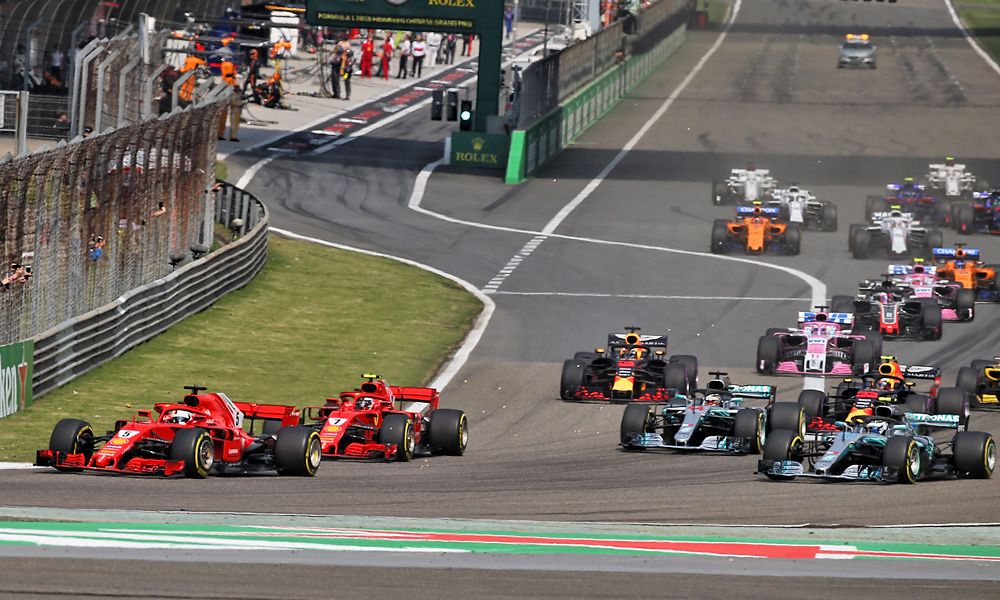 Sebastian Vettel (GER) Ferrari SF71H leads at the start of the Chinese Grand Prix