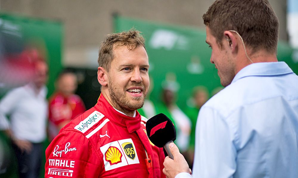 Race winner Sebastian Vettel (GER) Ferrari with Paul di Resta (GBR) Sky Sports